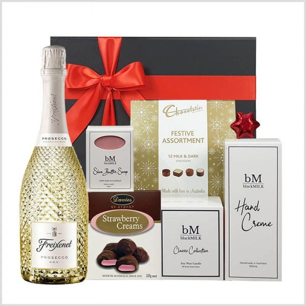 Christmas Glamour gift hamper with beauty products and candle